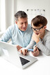© epiximages - Online shopping concept. Dad and son using laptop for online shopping during corona crisis.