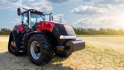 Poster - Red tractor on a agricultural field	
