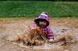 © Johnér - Toddler girl splashing in puddle