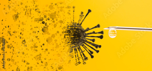 vaccine drop in syringe of Covid19 coronavirus vaccine in a research medical lab doctor on yellow background.injection to virus coronavirus.Medical hospital.Covid-19 coronavirus vaccine.Laboratory.