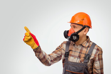 Canvas Print - Construction  Worker in Safety Equipment Pointing At Something. Instructs by job safety.