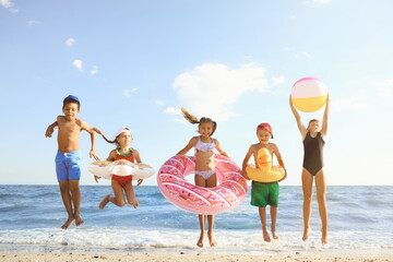 Poster - Cute children enjoying sunny day at beach. Summer camp