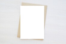 Blank Vertical Card Mockup, Invitation, Greeting Card Mock Up, Brown Envelope, Wooden Background, Minimal Style.