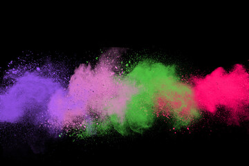 Wall Mural - abstract multicolor powder on black background. holi festival.