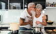 © Alessandro Biascioli - Happy senior couple having fun cooking together at home - Elderly people preparing health lunch in modern kitchen - Retired lifestyle family time and food nutrition concept