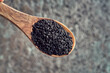 Black cumin seeds on a spoon