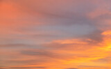 Fototapeta Zachód słońca - Beautiful colorful bright sunset sky with orange clouds. Nature sky background. Dramatic sunset.