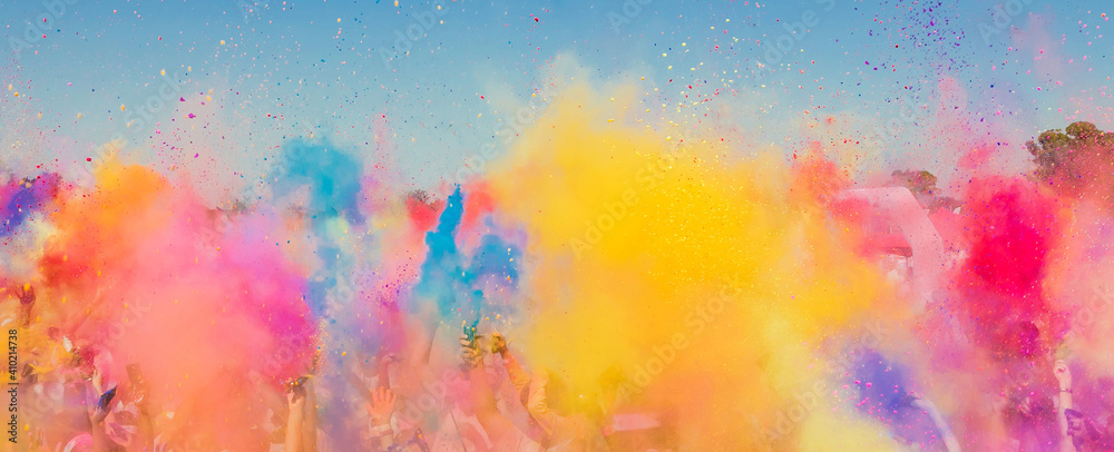 Group of people playing with colorful powder at a festival in South Africa - obrazy, fototapety, plakaty 
