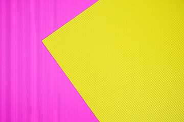 Pink and yellow two tone color paper background with stripes. Abstract background modern hipster futuristic. Texture design