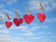 four hearts hanging on a string