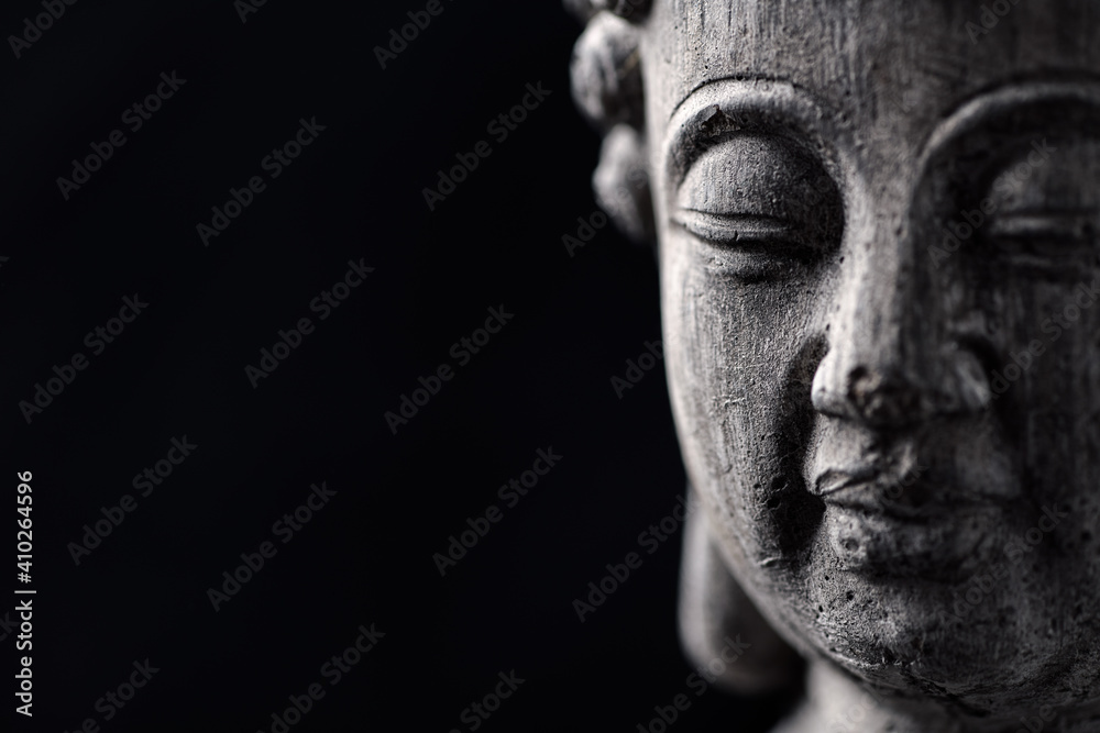Obraz na płótnie Meditating Buddha Statue isolated on black background. Copy space.	 w salonie