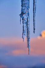 Icicles Against Blue Sky During Sunset