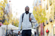 © Miguel Angel Partido Garcia/Westend61 - Man carrying backpack while walking in city