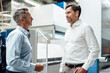 © Joseffson/Westend61 - Business people having discussion while standing at industry