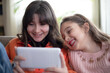 © izzetugutmen - child girls watching funny movie on  tablet pc
