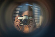 A female photographer takes pictures with a retro camera