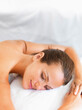 © Yuri Arcurs/Tetra Images - Woman relaxing in spa