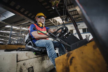 worker forklift driver working in industrial factory or warehouse. worker Asia