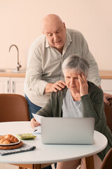 Poster - Stressed senior couple in debt at home