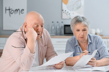 Sticker - Stressed senior couple in debt at home