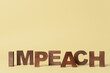 Word IMPEACH on color background