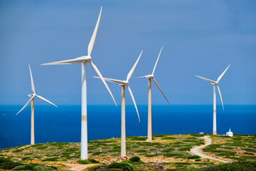 green renewable alternative energy concept - wind generator turbines generating electricity. wind fa