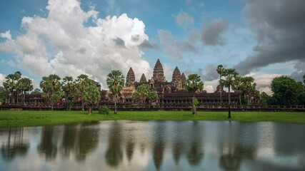 Wall Mural - Timelapse view of dramatic skies over the ancient ruins of Angkor Wat temple near Siem Reap, Cambodia. 