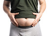© filin174 - Close up of man grabbing his fat on the stomach
