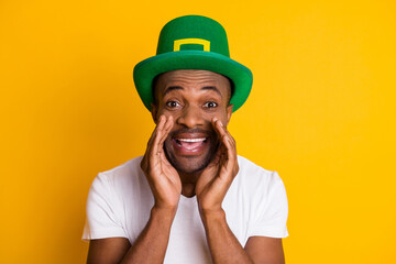 Wall Mural - Close-up portrait of his he nice attractive glad cheerful cheery guy wearing festal hat sharing saying advice ad advert isolated over bright vivid shine vibrant yellow color background