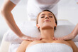 © LIGHTFIELD STUDIOS - female masseur doing massage to pleased client in spa salon