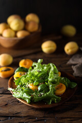 Wall Mural - Fresh arugula salad with apricots