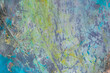 © BUSLIQ - colorful creative motley background: smudged residues of oil paints on a wooden palette, short focus, selective blur
