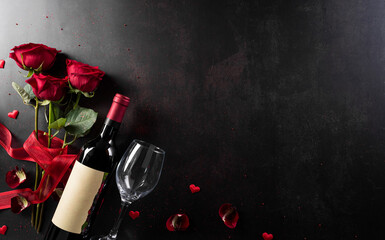 Love and Valentine's day concept made from champagne glasses , red hearts and rose on dark stone background. Top view with copy space, flat lay.