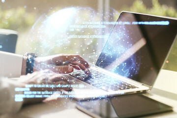 multi exposure of abstract graphic coding sketch with world map and hands typing on computer keyboar