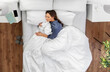 © Syda Productions - people, relax and comfort concept - young woman sleeping in bed at home