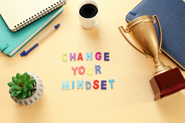 Poster - concept image with change your mindset text. top view of office table