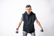 © tai - Happy and smiling Attractive of an older active senior Asian man training, exercising, workout at home with lifting weights dumbbells over on white background. Active and healthy senior concept