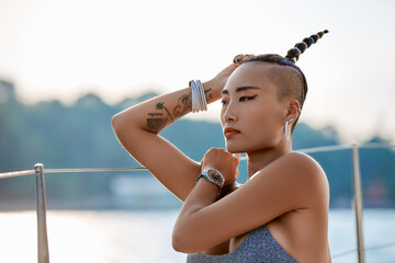 Close-Up portrait of young asian girl enjoying evening at the yacht