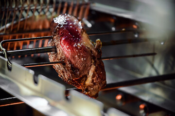 juicy beef from skewer at Brazilian steakhouse