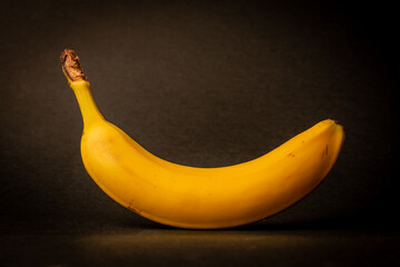 banana on black background, man erection