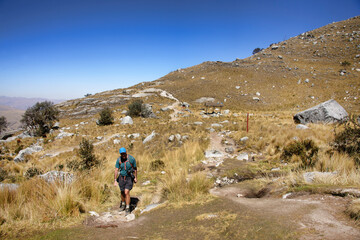 Wall Mural - Hiker at the scenic Laguna Churup trail, Huascaran National Park, Huaraz, Peru 