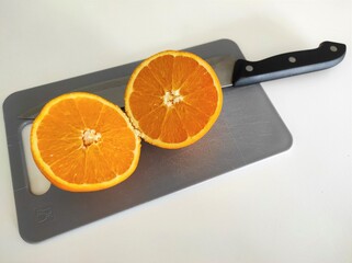 Orange sliced in half.

Zagreb, Croatia - February 2nd 2021