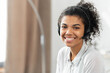 © Vadim Pastuh - Headshot of friendly charming African American mixed-race woman in headset, smiling at camera working in the customer service department as call center operator, providing consultations on the phone