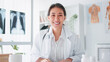 © Urbanscape - Portrait of Asian female doctor smiling, look at camera, online video call remote meeting. Healthcare job,Tele medical, telehealth, hospital clinic health care service, or internet technology concept