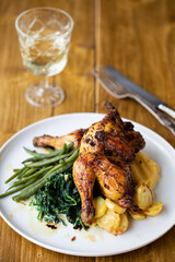 Wall Mural - Roasted poussin with potatoes, mashed swede, green beans and creamy spinach