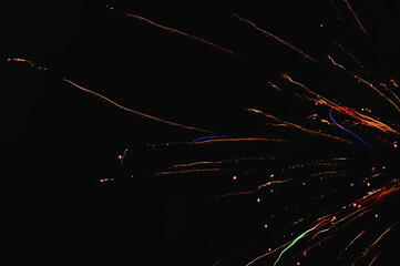 Closeup shot of colorful fireworks in the dark night sky - festive concept