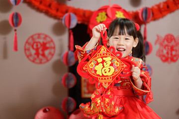 Wall Mural - young chinese girl with traditional dressing up holding 