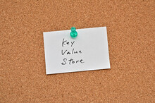 A Piece Of Paper Labeled Key Value Store Is Pinned To The Corkboard.