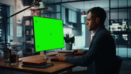 Aufkleber - Handsome Caucasian Specialist Working on Desktop Computer with Green Screen Mock Up Display at Home Living Room. Freelance Man Chatting to Clients Over the Internet on Social Networks.