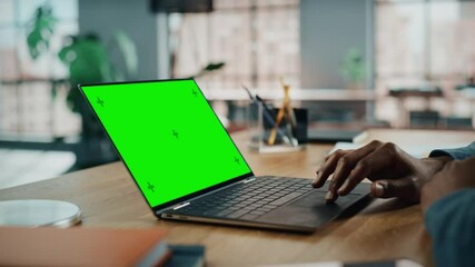 Aufkleber - Close Up on Hands of Black African American Specialist Working on Laptop Computer with Green Screen Mock Up Display at Home Living Room. Freelance Man Chatting to Clients Over the Internet.